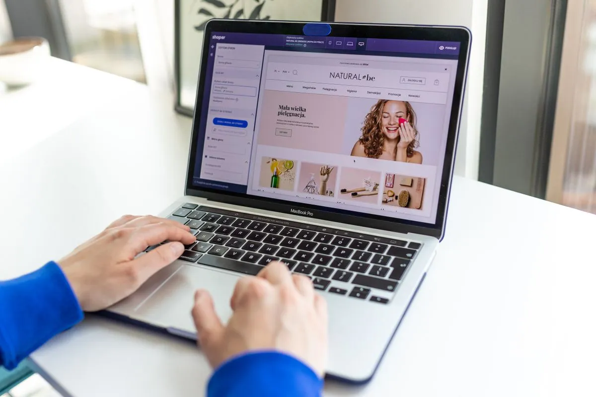 Laptop screen showing website template layouts in a builder