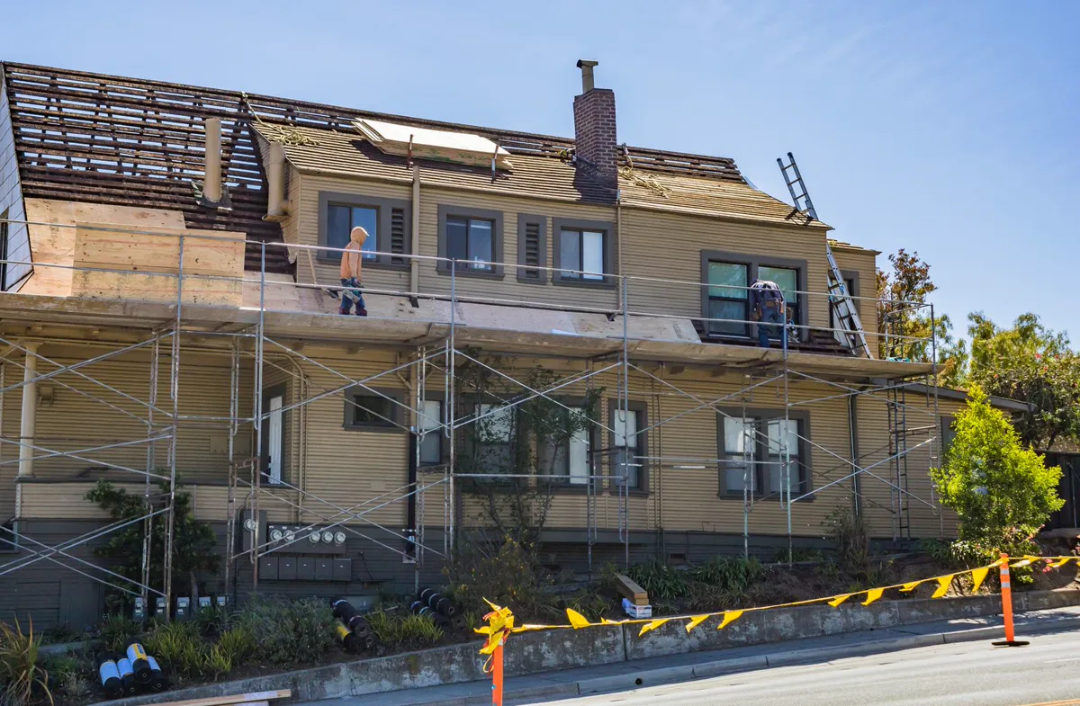 Roofer working on a residential roof in Perth