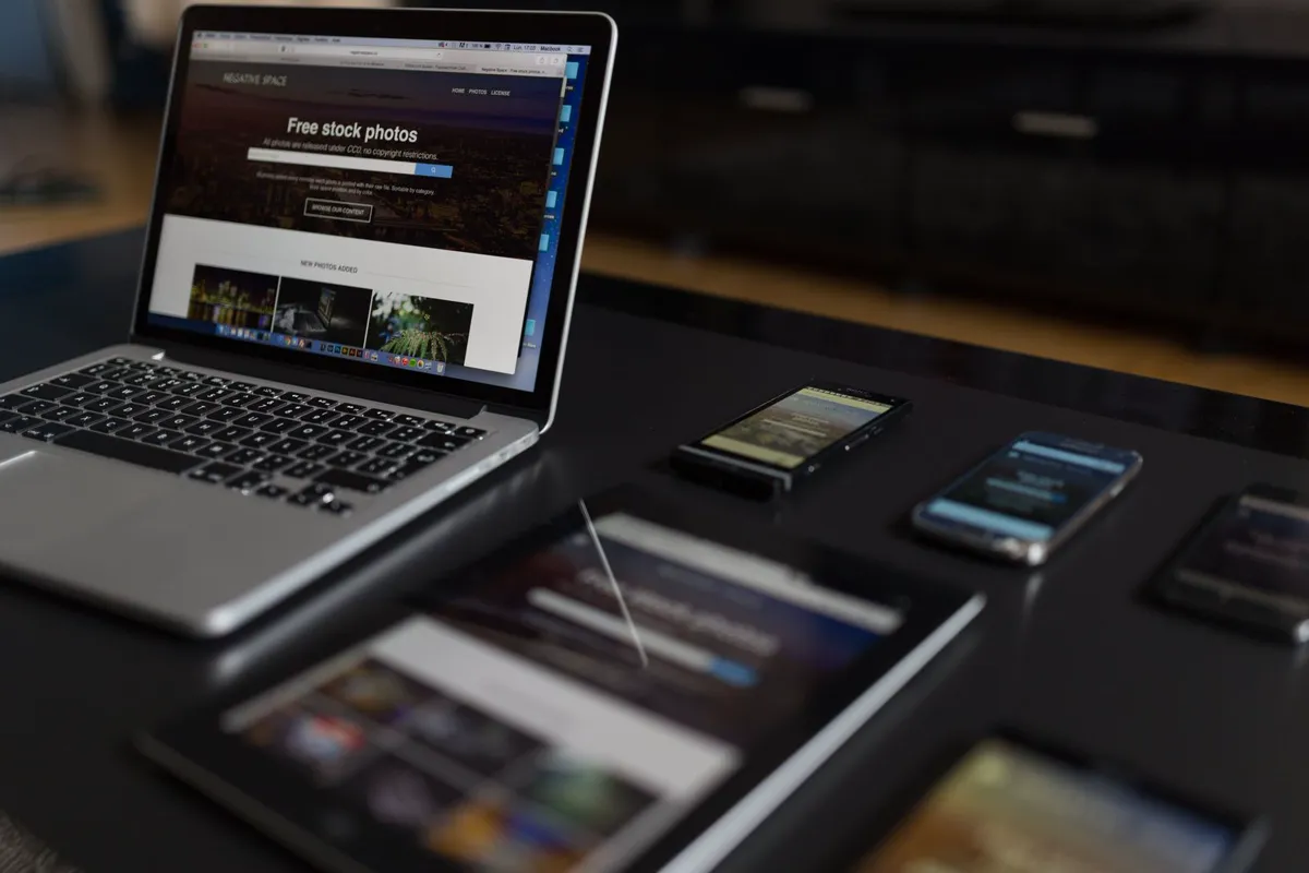 Laptop open on a desk for reviewing a roofing website design