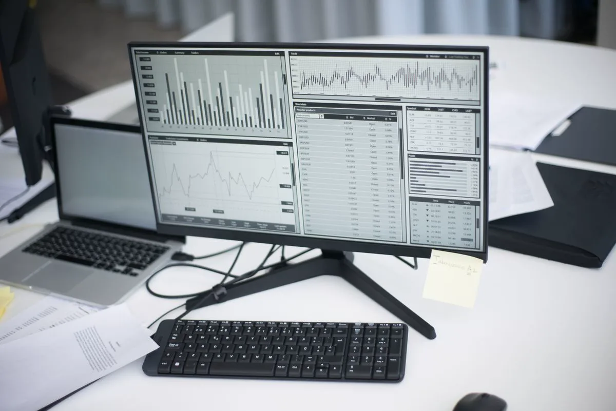 Laptop showing website analytics and search performance charts on a desk