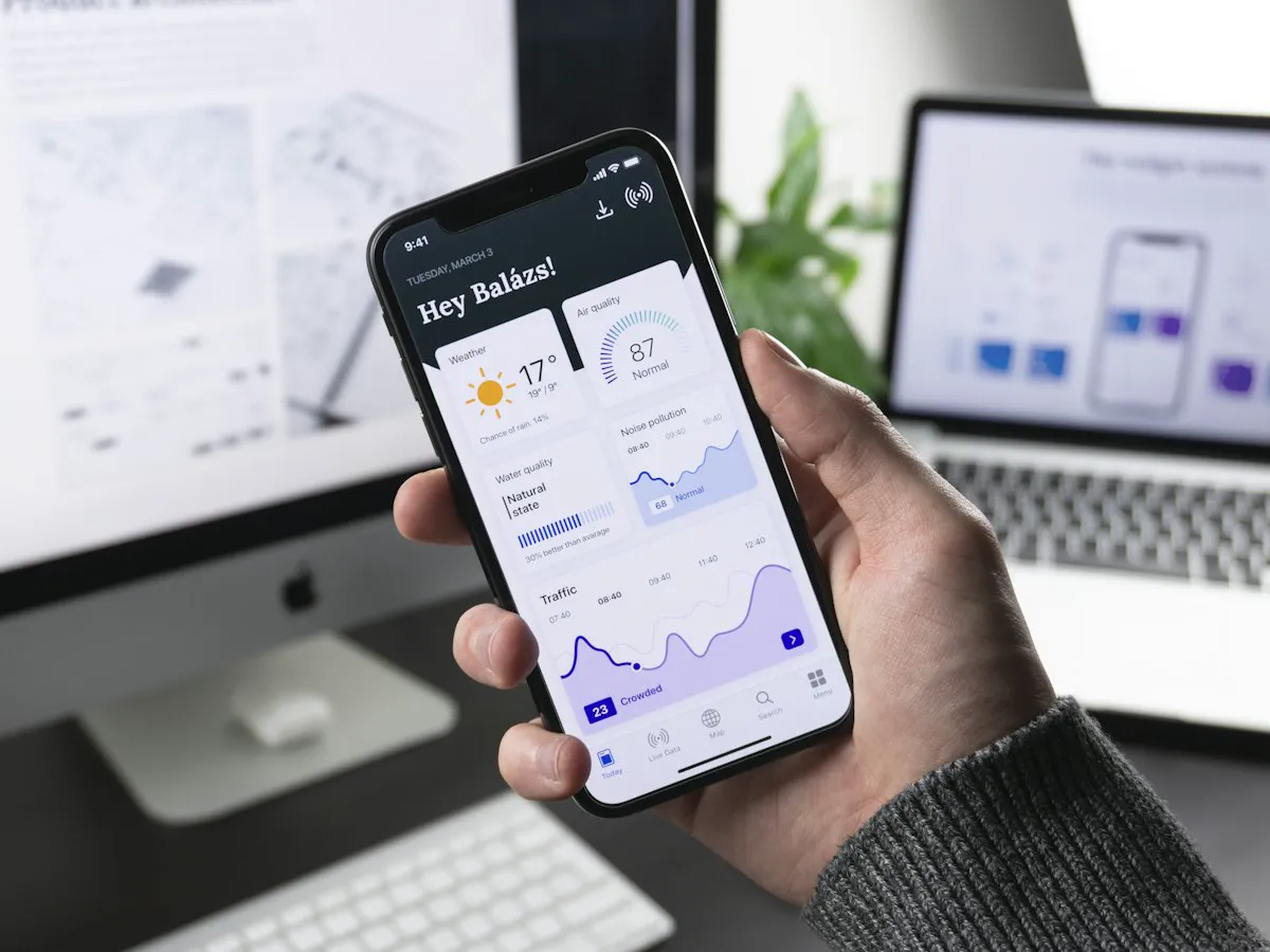 Hand holding a smartphone showing a business website